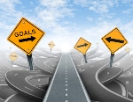 Goals (1) Clear strategy and solutions for business leadership symbol with a straight path to success as a journey choosing the right strategic path for business with blank yellow traffic signs cutting through a maze of tangled roads and highways.